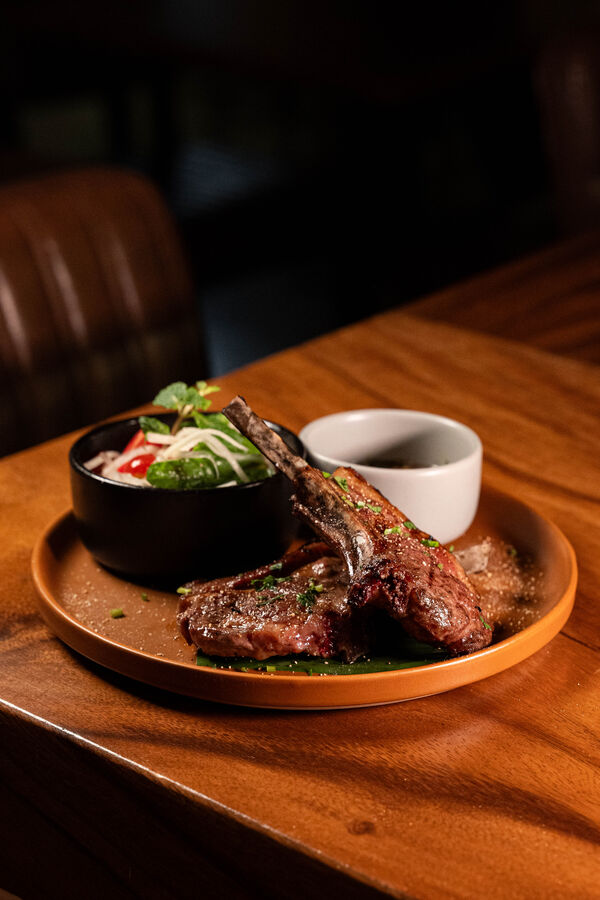 Chargrilled lamb cutlets with nam jim jeaw and mint papaya salad